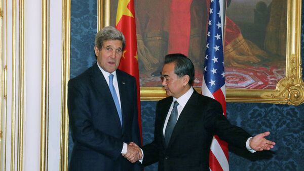 U.S. Secretary of State John Kerry and Chinese Foreign Minister Wang Yi, from left, pose for a photograph prior to a bilateral meeting of the closed-door nuclear talks with Iran, Austria - Sputnik International