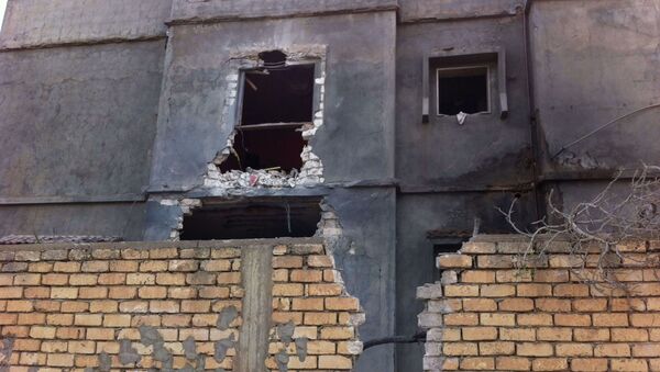 A damaged building near Mitiga airport in Libya's capital Tripoli. - Sputnik International