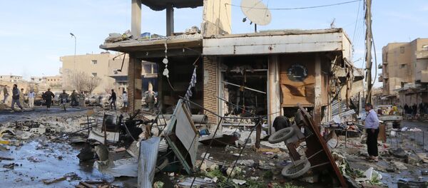 A site hit by what activists said were airstrikes by forces loyal to Syria's President Bashar al-Assad is pictured in Raqqa, eastern Syria, which is controlled by the Islamic State November 25, 2014 A site hit by what activists said were airstrikes by forces loyal to Syria's President Bashar al-Assad is pictured in Raqqa, eastern Syria, which is controlled by the Islamic State November 25, 2014 - Sputnik International