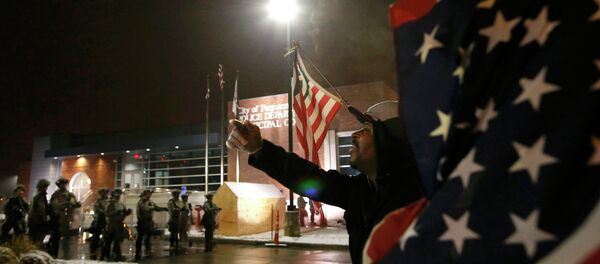 A protester shouts at the National Guard standing on duty outside the Ferguson Police Department after the grand jury verdict in the Michael Brown shooting in Ferguson, Missouri, November 26, 2014 - Sputnik International