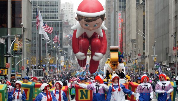 The Elf on the Shelf balloon is marched down Sixth Avenue during the Macy's Thanksgiving Day Parade, Thursday, Nov. 27, 2014, in New York - Sputnik International