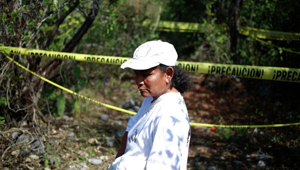 A woman with missing relatives in Mexico. - Sputnik International