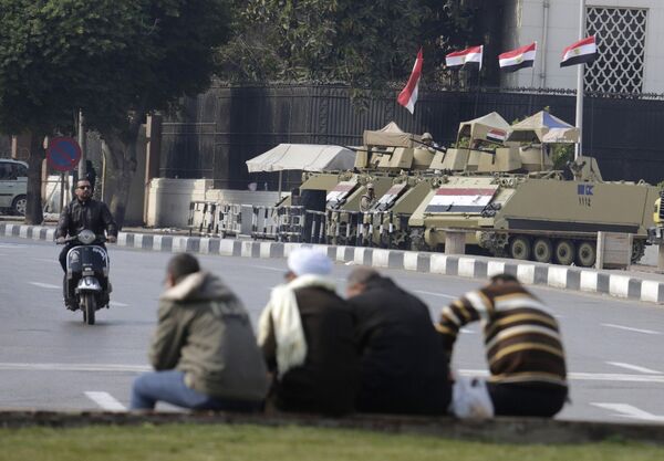 Armored vehicles stand alert at the entrance of Tahrir Square in Cairo, Egypt, Friday, Nov. 28, 2014 Armored vehicles stand alert at the entrance of Tahrir Square in Cairo, Egypt, Friday, Nov. 28, 2014 - Sputnik International