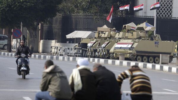 Armored vehicles stand alert at the entrance of Tahrir Square in Cairo, Egypt, Friday, Nov. 28, 2014 - Sputnik International