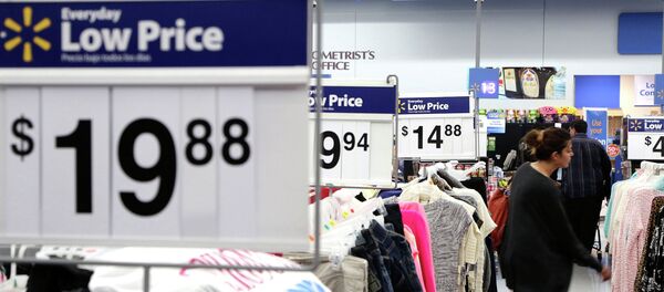 A woman shops at Walmart as the store prepares for Black Friday in Los Angeles, California November 24, 2014 A woman shops at Walmart as the store prepares for Black Friday in Los Angeles, California November 24, 2014 - Sputnik International