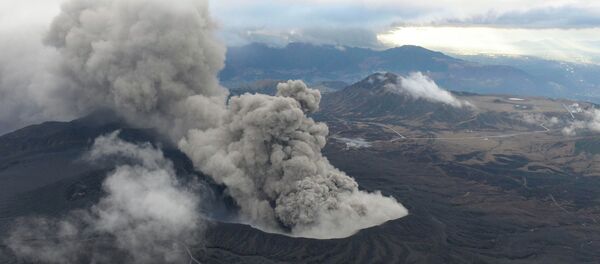 An aerial view shows volcanic smoke spew from Mount Aso in Aso, Kumamoto prefecture, southwestern Japan, in this photo taken by Kyodo November 26, 2014 An aerial view shows volcanic smoke spew from Mount Aso in Aso, Kumamoto prefecture, southwestern Japan, in this photo taken by Kyodo November 26, 2014 - Sputnik International