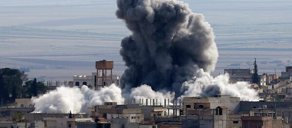 An explosion following an air strike is seen in western Kobani neighbourhood, November 23, 2014 An explosion following an air strike is seen in western Kobani neighbourhood, November 23, 2014 - Sputnik International