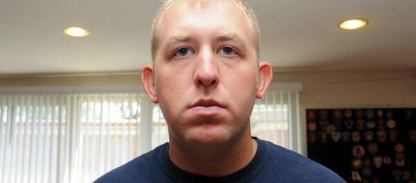 Officer Darren Wilson is pictured in this undated handout evidence photo from the August 9 Ferguson Police shooting of Michael Brown in Ferguson, Missouri, released by the St. Louis County Prosecutor's Office on November 24, 2014. Officer Darren Wilson is pictured in this undated handout evidence photo from the August 9 Ferguson Police shooting of Michael Brown in Ferguson, Missouri, released by the St. Louis County Prosecutor's Office on November 24, 2014. - Sputnik International