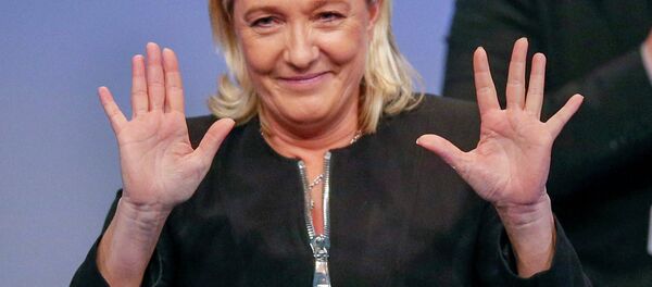 Marine Le Pen, France's National Front political party leader, gestures as she attends the French far-right party's congress in Lyon November 29, 2014 Marine Le Pen, France's National Front political party leader, gestures as she attends the French far-right party's congress in Lyon November 29, 2014 - Sputnik International