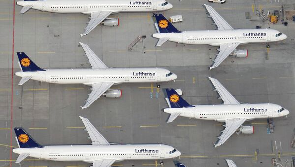 An aerial view shows Lufthansa planes parked on the tarmac of the closed Frankfurt's airport - Sputnik International