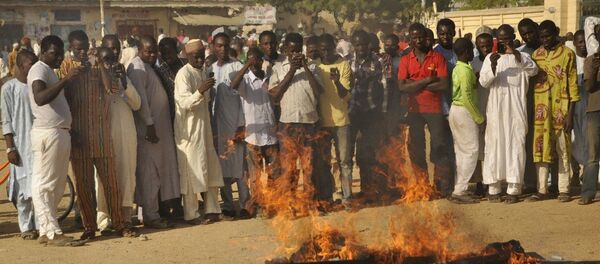 People gather at the site of a bomb explosion in Kano, Nigeria People gather at the site of a bomb explosion in Kano, Nigeria - Sputnik International