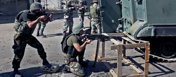 Lebanese army soldiers open fire during clashes with Islamic militants in the northern port city of Tripoli, Lebanon. Lebanese army soldiers open fire during clashes with Islamic militants in the northern port city of Tripoli, Lebanon. - Sputnik International