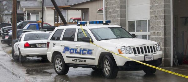 Westover Police vehicles are parked outside Doug's Towing in Westover, W.V.,, Monday, Dec. 1, 2014, after three separate shootings left four people dead on Monday Westover Police vehicles are parked outside Doug's Towing in Westover, W.V.,, Monday, Dec. 1, 2014, after three separate shootings left four people dead on Monday - Sputnik International