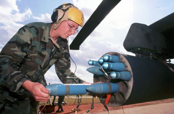 In this undated handout photo released by General Dynamics, a technician loads Hydra-70 rockets In this undated handout photo released by General Dynamics, a technician loads Hydra-70 rockets - Sputnik International