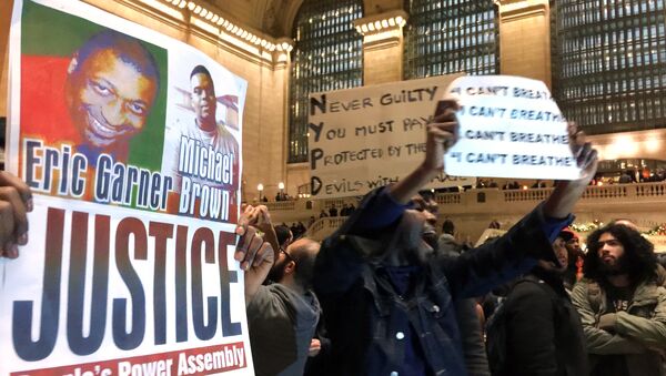 People protest in Grand Central Terminal after it was announced that the New York City police officer involved in the death of Eric Garner was not indicted, Wednesday, Dec. 3, 2014. - Sputnik International