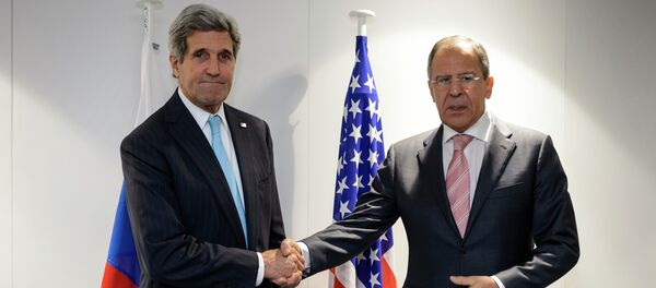 US Secretary of State John Kerry (L) shake hands with Russia's Foreign Minister Sergey Lavrov at the meeting of foreign ministers from the Organization for Security and Cooperation in Europe (OSCE) in Basel. - Sputnik International