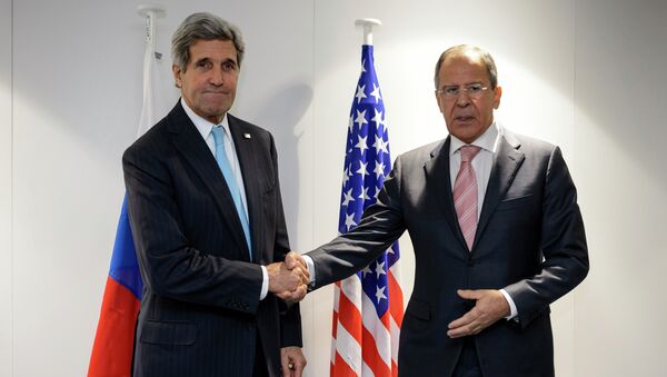 U.S. Secretary of State John Kerry (L) shake hands with Russia's Foreign Minister Sergey Lavrov at the meeting of foreign ministers from the Organization for Security and Cooperation in Europe (OSCE) in Basel - Sputnik International