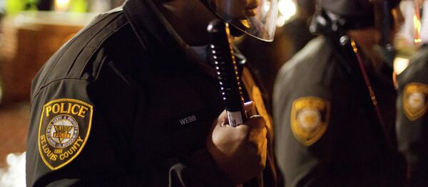 Police stand guard during a demonstration outside the Ferguson Police Department, Saturday, Nov. 22, 2014, in Ferguson, Mo. Police stand guard during a demonstration outside the Ferguson Police Department, Saturday, Nov. 22, 2014, in Ferguson, Mo. - Sputnik International