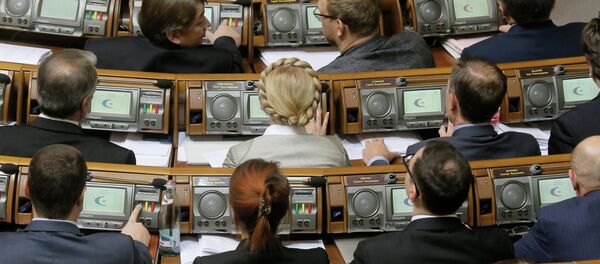 Former Prime Minister and leader of the Fatherland party Yulia Tymoshenko, center, and lawmakers from her party vote during a parliament session in Kiev, Ukraine, Tuesday, Dec. 2, 2014 Former Prime Minister and leader of the Fatherland party Yulia Tymoshenko, center, and lawmakers from her party vote during a parliament session in Kiev, Ukraine, Tuesday, Dec. 2, 2014 - Sputnik International