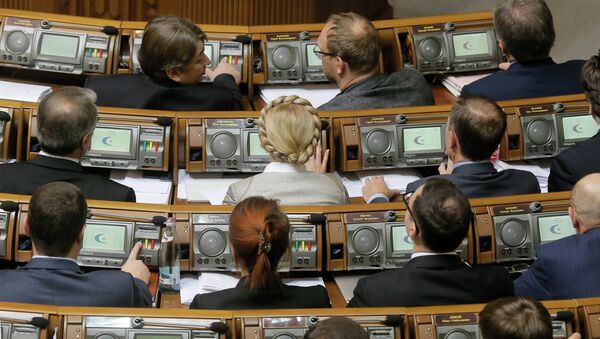 Former Prime Minister and leader of the Fatherland party Yulia Tymoshenko, center, and lawmakers from her party vote during a parliament session in Kiev, Ukraine, Tuesday, Dec. 2, 2014 - Sputnik International