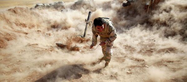 A Kurdish Peshmerga fighter launches mortar shells towards Zummar, controlled by Islamic State (IS), near Mosul in this September 15, 2014 file photo A Kurdish Peshmerga fighter launches mortar shells towards Zummar, controlled by Islamic State (IS), near Mosul in this September 15, 2014 file photo - Sputnik International