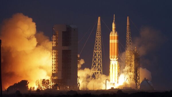 NASA's Orion spacecraft, atop a United Launch Alliance Delta 4-Heavy rocket, lifts off on its first unmanned orbital test flight from the Cape Canaveral Air Force Station Friday, Dec. 5, 2014 - Sputnik International