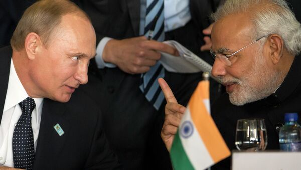 Russia's President Vladimir Putin, left, and India's Prime Minister Narendra Modi chat during the BRICS Summit at the Itamaraty Palace, in Brasilia, Brazil, Wednesday, July 16, 2014 - Sputnik International