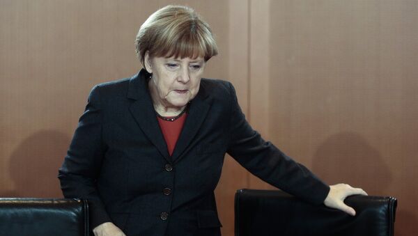 German Chancellor Angela Merkel arrives for the cabinet meeting in Berlin, Germany, Wednesday, Dec. 3, 2014 - Sputnik International