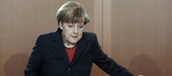 German Chancellor Angela Merkel arrives for the cabinet meeting in Berlin, Germany, Wednesday, Dec. 3, 2014 German Chancellor Angela Merkel arrives for the cabinet meeting in Berlin, Germany, Wednesday, Dec. 3, 2014 - Sputnik International