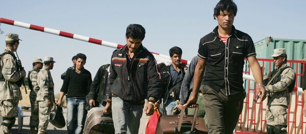 Afghan refugees enter Afghan territory after leaving Iran at the Islam Qala border crossing in Kohsan, Herat, west of Kabul, Afghanistan, Sunday, Nov.11, 2012 Afghan refugees enter Afghan territory after leaving Iran at the Islam Qala border crossing in Kohsan, Herat, west of Kabul, Afghanistan, Sunday, Nov.11, 2012 - Sputnik International