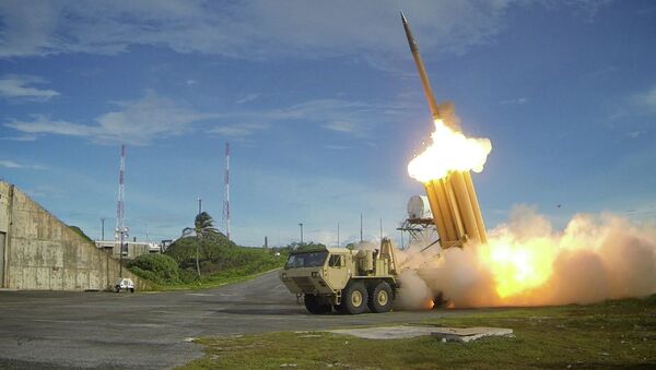 A file photo showing two Terminal High Altitude Area Defense (THAAD) interceptors being launched - Sputnik International