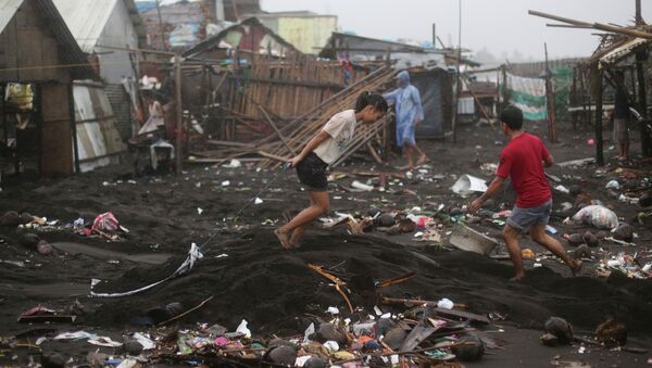 Typhoon Hagupit destroyed coastal communities on the eastern provinces of the Philippines; 27 people are dead and 1.7 million remain in emergency shelters. The country's capital is spared, as Hagupit weakens on Tuesday. - Sputnik International