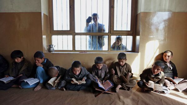 In this file photo taken Tuesday, Nov. 11, 2014, Afghan children recite the Quran, Islam's holy book, at a local Madrassa, or seminary, in Kabul, Afghanistan - Sputnik International