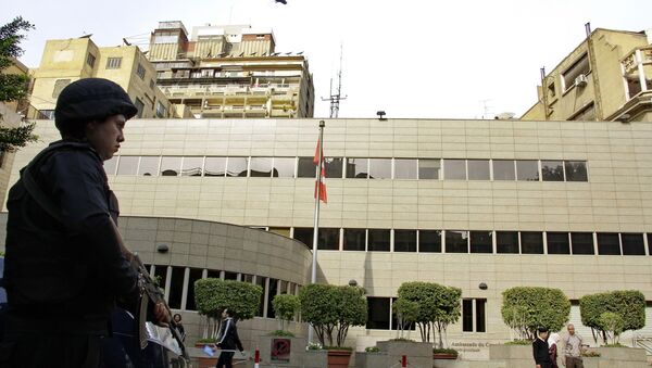 Security forces are deployed in front of the Canadian embassy in Cairo, Egypt, which closed to the public on Monday, Dec. 8, 2014 - Sputnik International