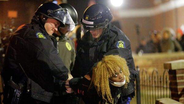 Police officers take a protester into custody Tuesday, Nov. 25, 2014, in Ferguson - Sputnik International