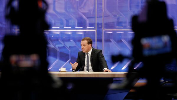 December 10, 2014. Prime Minister Dmitry Medvedev gives a live interview on the annual results of the government work to major Russian television channels at the Ostankino television center. - Sputnik International