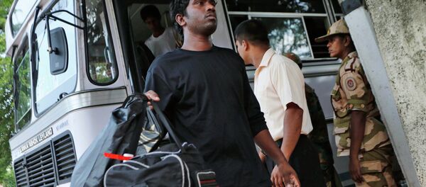 A deported Sri Lankan disembarks from a bus outside a court in Negombo, Sri Lanka A deported Sri Lankan disembarks from a bus outside a court in Negombo, Sri Lanka - Sputnik International
