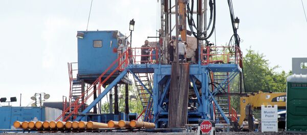 A crew works on a drilling rig at a well site for shale based natural gas in Zelienople A crew works on a drilling rig at a well site for shale based natural gas in Zelienople - Sputnik International