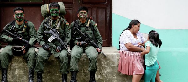 Members of the Bolivian combined forces of army and police rest at their headquarters at the end of their ceremony for the task of fighting against drugs and the eradication of coca leaves in Chimore, east of La Paz - Sputnik International