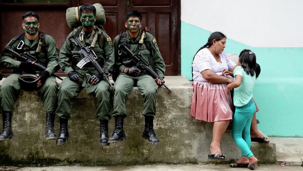 Members of the Bolivian combined forces of army and police rest at their headquarters at the end of their ceremony for the task of fighting against drugs and the eradication of coca leaves in Chimore, east of La Paz - Sputnik International