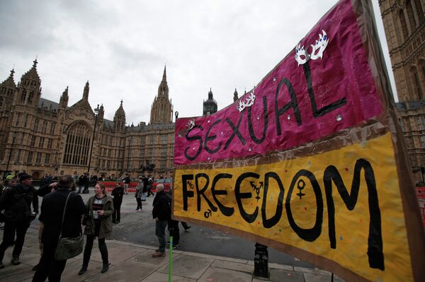 A banner is seen during a demonstration against what protesters call porn censorship, across from the Houses of Parliament in central London - Sputnik International