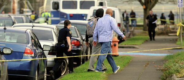 Police have arrested a suspect for the shooting injury of four students at Rosemary Anderson High School in Portland, Oregon. Photo: Police evacuating students from the school Friday Police have arrested a suspect for the shooting injury of four students at Rosemary Anderson High School in Portland, Oregon. Photo: Police evacuating students from the school Friday - Sputnik International