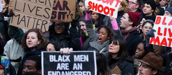 Demonstrators march in New York, Saturday, Dec. 13, 2014, during the Justice for All rally and march Demonstrators march in New York, Saturday, Dec. 13, 2014, during the Justice for All rally and march - Sputnik International