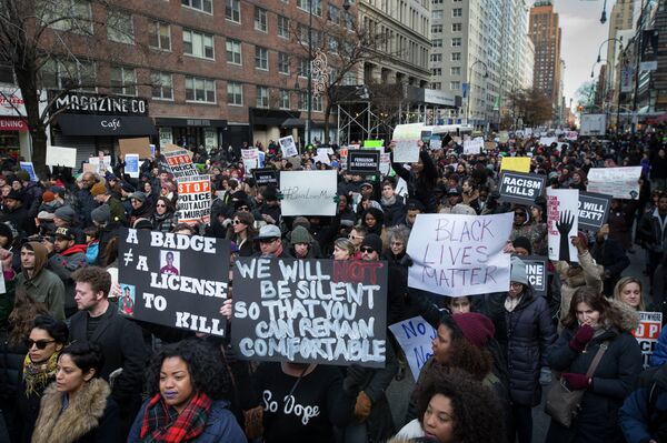 Demonstrators march in New York, Saturday, Dec. 13, 2014, during the Justice for All rally and march Demonstrators march in New York, Saturday, Dec. 13, 2014, during the Justice for All rally and march - Sputnik International