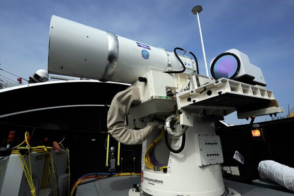 The Laser Weapon System (LaWS) temporarily installed aboard the guided-missile destroyer USS Dewey (DDG 105) in San Diego The Laser Weapon System (LaWS) temporarily installed aboard the guided-missile destroyer USS Dewey (DDG 105) in San Diego - Sputnik International