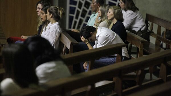 People attend a Mass in memory of Brazilian student Roberto Laudisio Curti at a church in Sao Paulo, Brazil, Thursday March 22, 2012 - Sputnik International