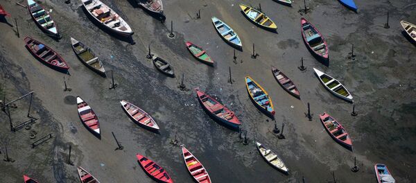 In this Nov. 19, 2013 file photo, small boats sit on the polluted shore of Guanabara Bay in the suburb of Sao Goncalo, across the bay from Rio de Janeiro, Brazil In this Nov. 19, 2013 file photo, small boats sit on the polluted shore of Guanabara Bay in the suburb of Sao Goncalo, across the bay from Rio de Janeiro, Brazil - Sputnik International