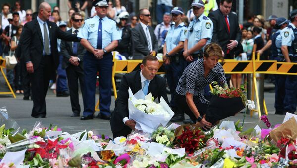Australian Prime Minister Tony Abbott and his wife Margie pay their respect to the victims of the siege in Martin Place in Sydney central business district, Australia - Sputnik International