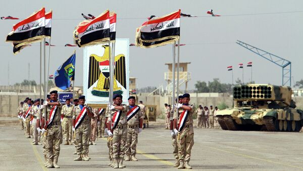 Iraqi Army soldiers march as part of a parade marking the founding anniversary of the army's artillery section in Baghdad - Sputnik International