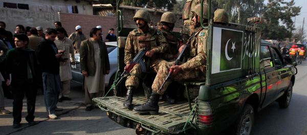 Pakistani security forces drive on a road leading to the Army Public School, which is under attack from Taliban gunmen, in Peshawar, December 16, 2014 Pakistani security forces drive on a road leading to the Army Public School, which is under attack from Taliban gunmen, in Peshawar, December 16, 2014 - Sputnik International